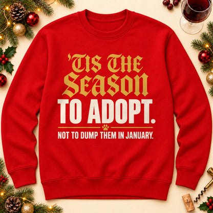 'Tis The Season To Adopt sweatshirt in Red, laid flat. [bb c=red r=flat]