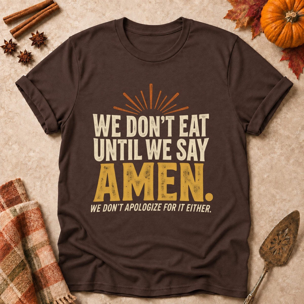 Until We Say Amen faith T-shirt in Dark Chocolate, laid flat. [bb c=dark-chocolate r=flat]