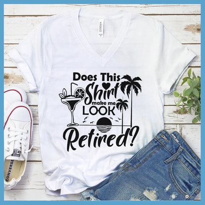 Does This Shirt Make Me Look Retired? Version 2 V-neck White - Humorous 'Does This Shirt Make Me Look Retired?' text with palm tree and cocktail graphics on V-neck tee.
