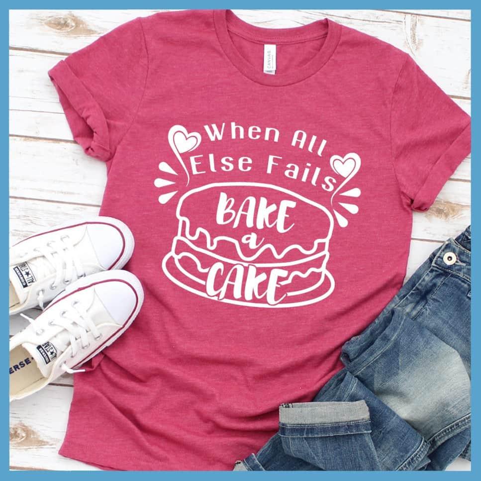 When All Else Fails Bake A Cake T-Shirt Heather Raspberry - Casual baking-themed t-shirt with whimsical cake design and uplifting phrase.