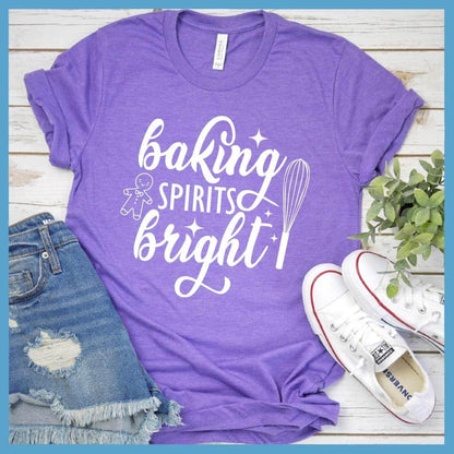 Baking Spirits Bright T-Shirt Heather Purple - Illustrated 'Baking Spirits Bright' text with festive kitchen utensils design on tee