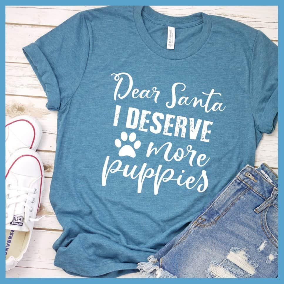 Dear Santa I Deserve More Puppies T-Shirt Heather Deep Teal - Humorous holiday-themed T-shirt with 'Dear Santa I Deserve More Puppies' message in festive script.