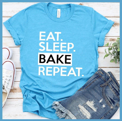Eat Sleep Bake Repeat T-Shirt Aqua - Illustration of fun 'Eat Sleep Bake Repeat' phrase on casual t-shirt for baking fans