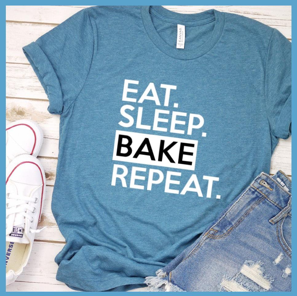 Eat Sleep Bake Repeat T-Shirt Heather Deep Teal - Illustration of fun 'Eat Sleep Bake Repeat' phrase on casual t-shirt for baking fans