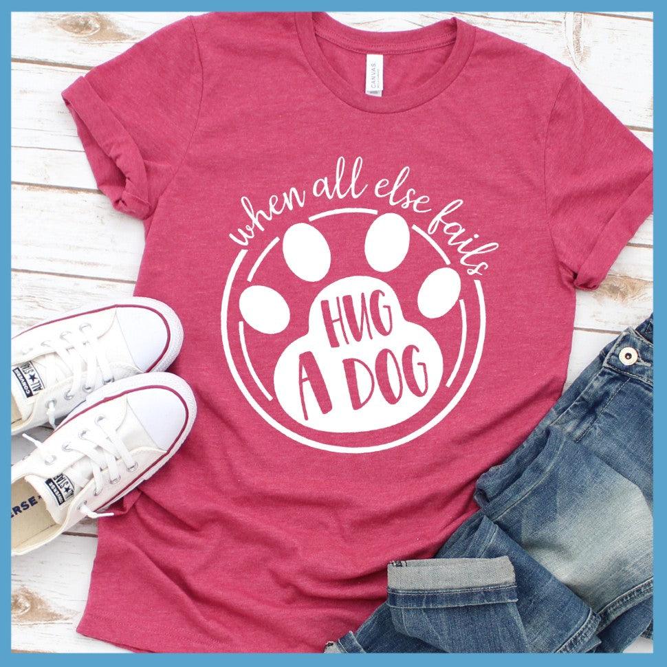 When All Else Fails Hug A Dog T-Shirt Heather Raspberry - Graphic tee with "When All Else Fails Hug A Dog" slogan, embodying pet lovers' spirit.