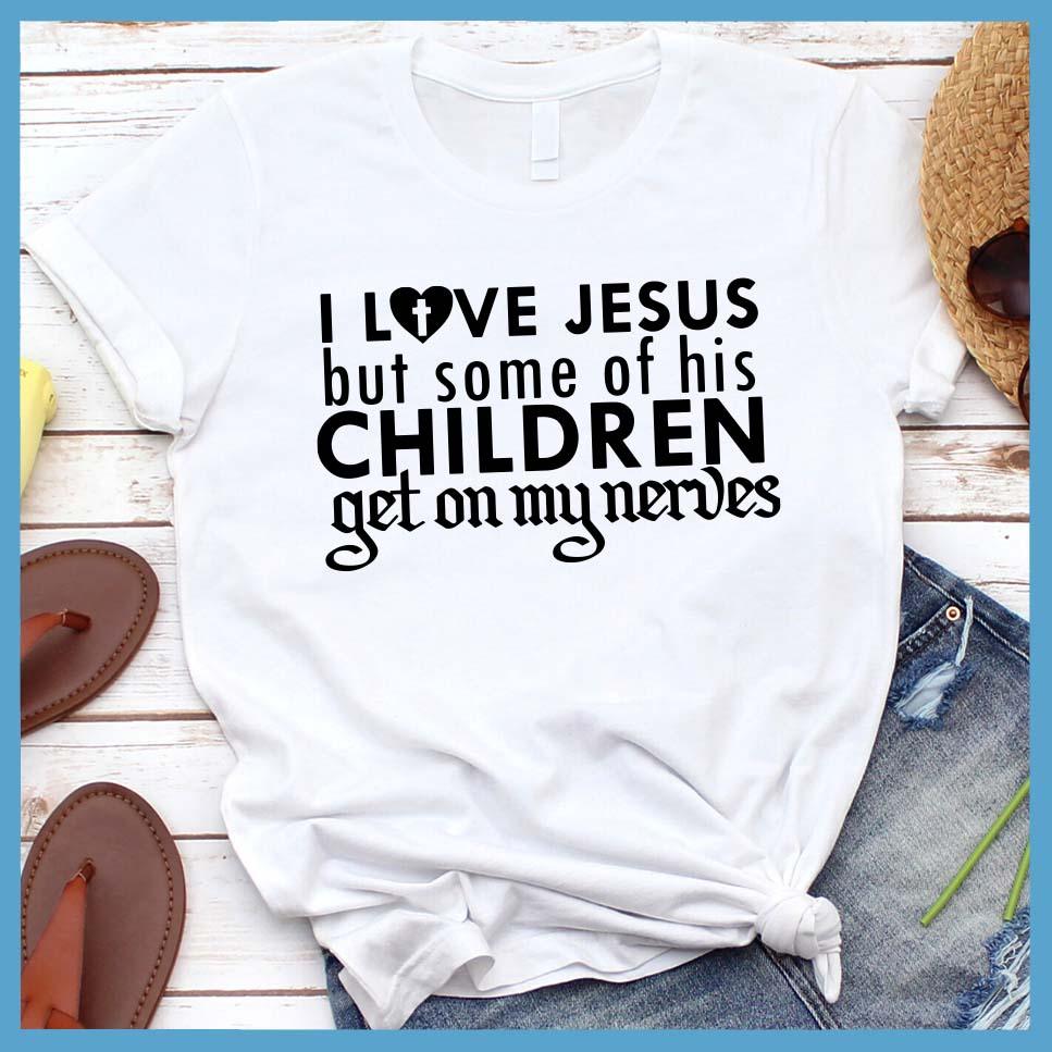 I Love Jesus But Some Of His Children T-Shirt White - Humorous 'I Love Jesus But Some Of His Children' faith-based T-shirt laid out with jeans and sneakers.