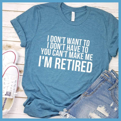 I Don't Want To I'm Retired T-Shirt Heather Deep Teal - Retirement slogan tee with humorous 'I Don't Want To I'm Retired' print, laid out with casual jeans and sneakers.
