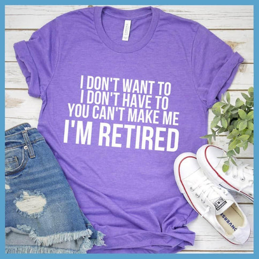 I Don't Want To I'm Retired T-Shirt Heather Purple - Retirement slogan tee with humorous 'I Don't Want To I'm Retired' print, laid out with casual jeans and sneakers.