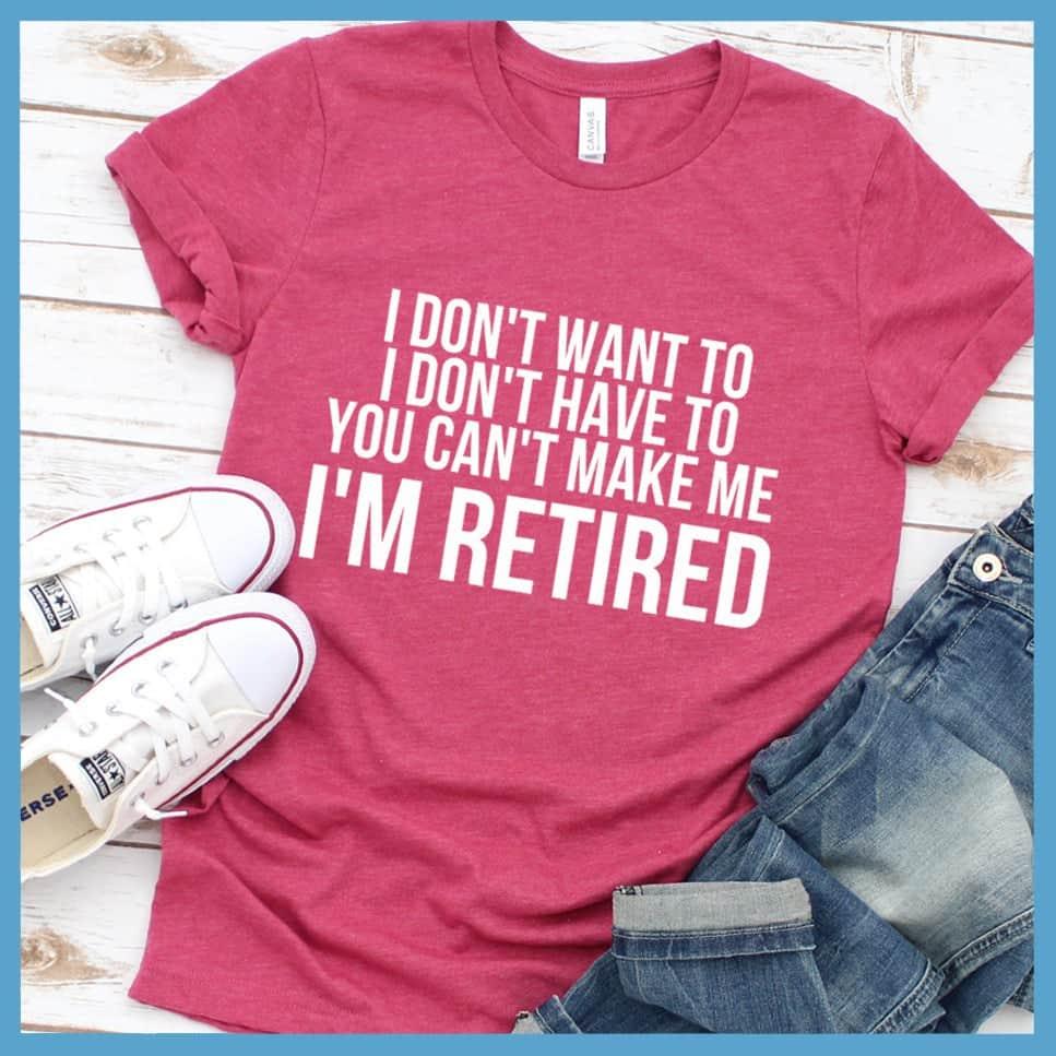I Don't Want To I'm Retired T-Shirt Heather Raspberry - Retirement slogan tee with humorous 'I Don't Want To I'm Retired' print, laid out with casual jeans and sneakers.