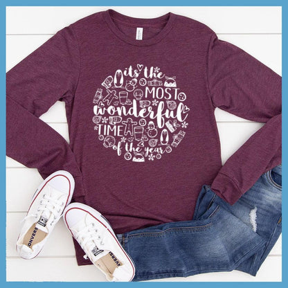Most Wonderful Time Of The Year Long Sleeves Maroon Triblend - Festive holiday-themed long sleeve tee with cheerful graphics celebrating the season.