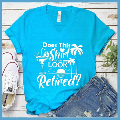 Does This Shirt Make Me Look Retired? Version 2 V-neck Neon Blue - Humorous 'Does This Shirt Make Me Look Retired?' text with palm tree and cocktail graphics on V-neck tee.