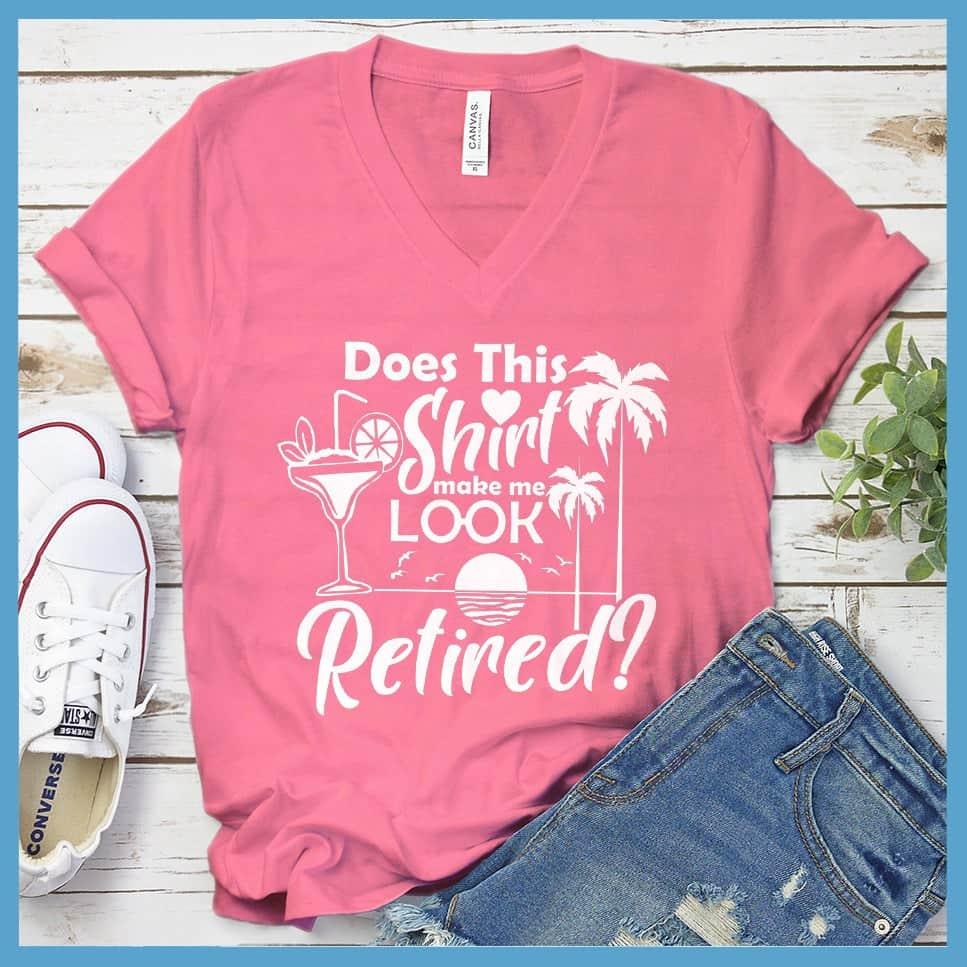Does This Shirt Make Me Look Retired? Version 2 V-neck Neon Pink - Humorous 'Does This Shirt Make Me Look Retired?' text with palm tree and cocktail graphics on V-neck tee.