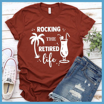 Rocking The Retired Life T-Shirt Rust - Retirement-themed t-shirt with palm tree and drink design celebrating the leisure life.