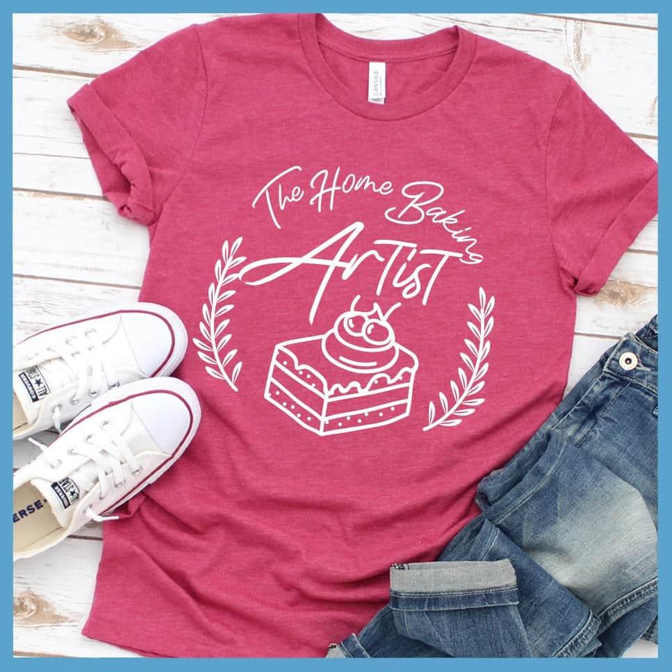 The Home Baking Artist T-Shirt Heather Raspberry - Casual baking-themed graphic t-shirt with dessert design, perfect for culinary enthusiasts.