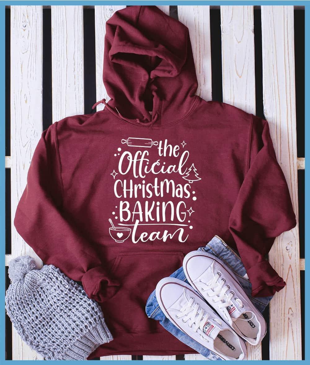 The Official Christmas Baking Team Hoodie Crimson Heather - Festive hoodie with Christmas baking theme design, perfect for holiday cooking.