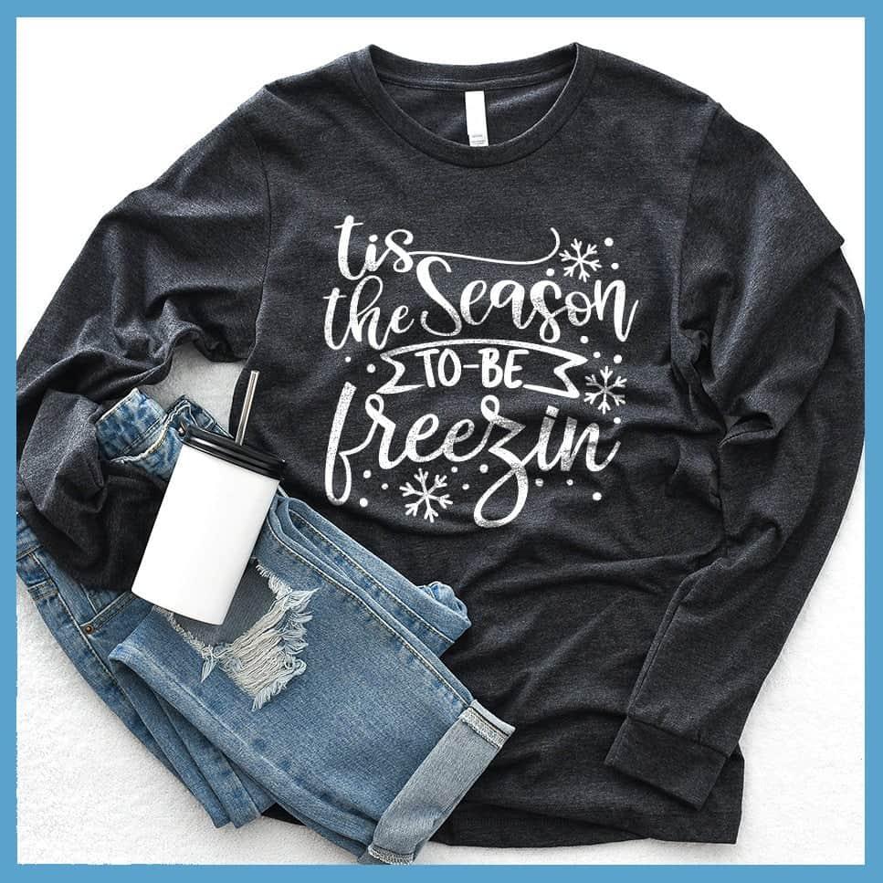 Tis The Season To Be Freezin Long Sleeves Dark Grey Heather - Long sleeve winter shirt with whimsical snowflake design and festive phrase.