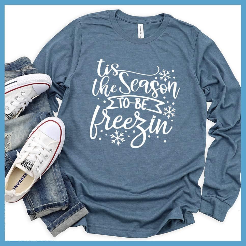 Tis The Season To Be Freezin Long Sleeves Heather Slate - Long sleeve winter shirt with whimsical snowflake design and festive phrase.