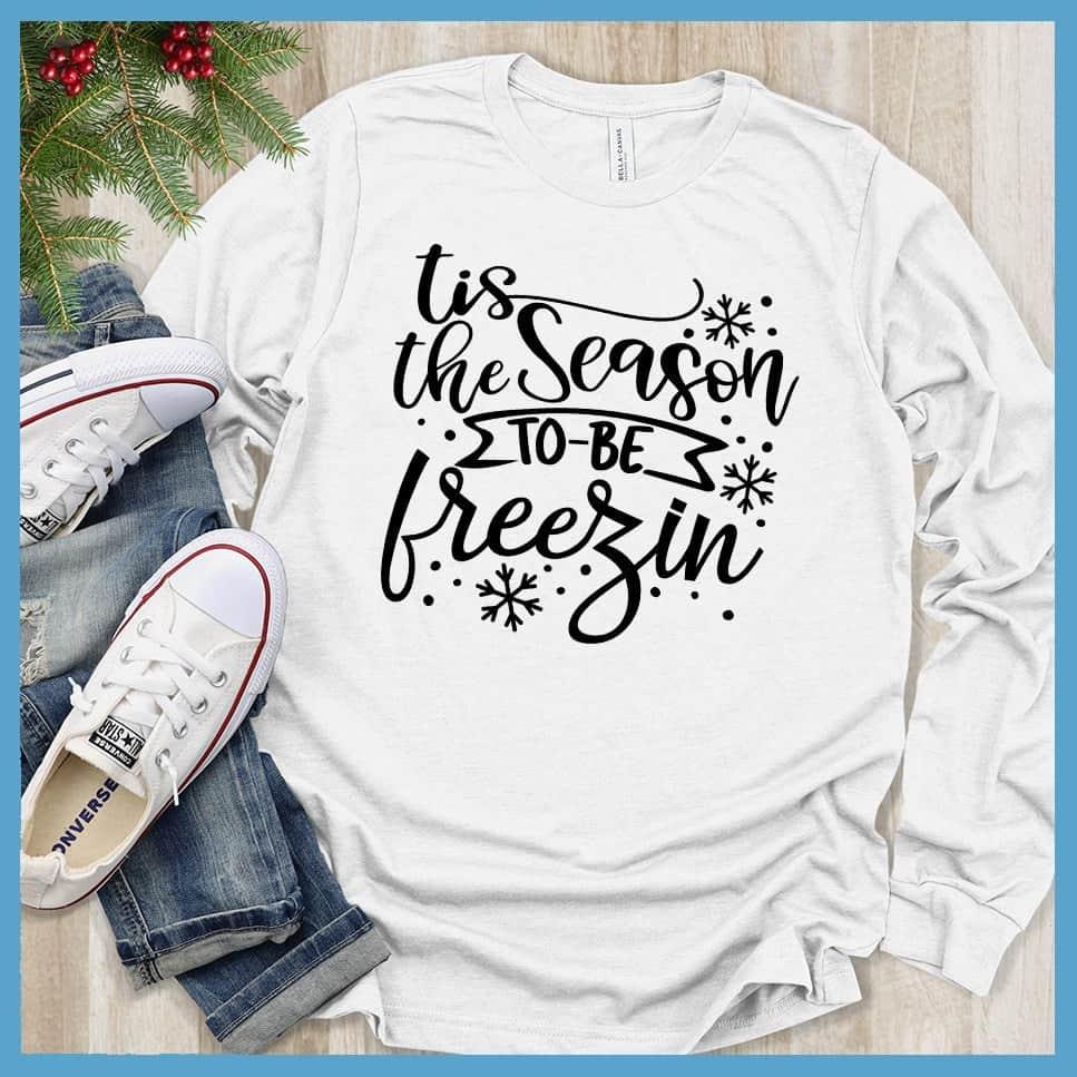 Tis The Season To Be Freezin Long Sleeves White - Long sleeve winter shirt with whimsical snowflake design and festive phrase.