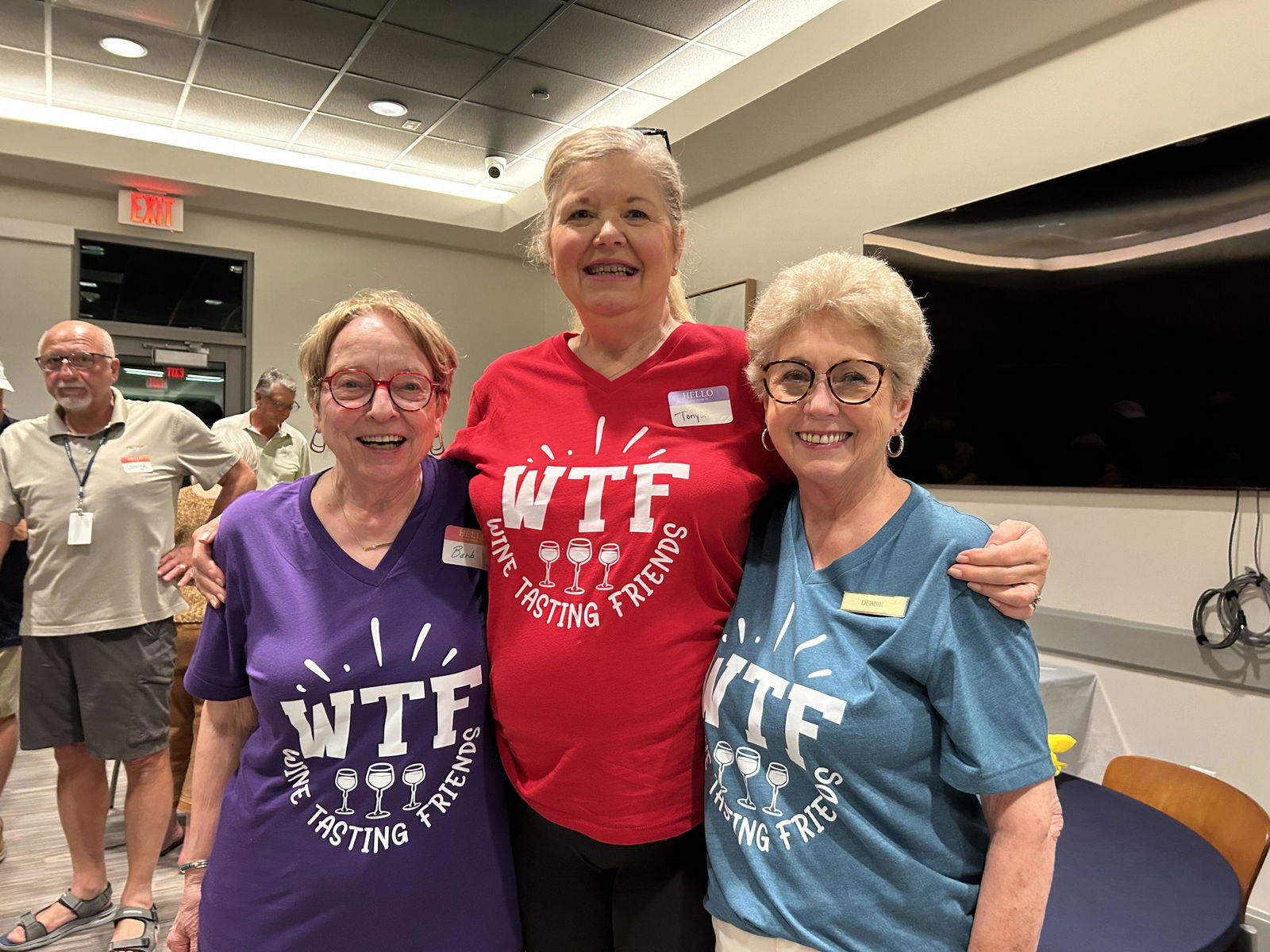 Friends wearing Brooke & Belle wine tasting shirts