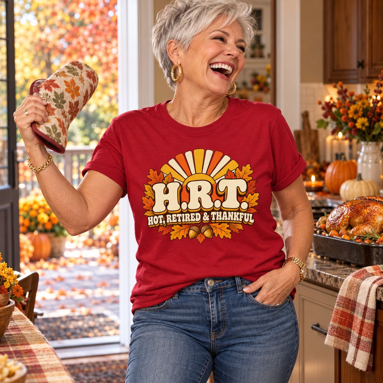 A woman fanning herself with an oven mitt in a Thanksgiving kitchen in the H.R.T. Hot, Retired and Thankful shirt